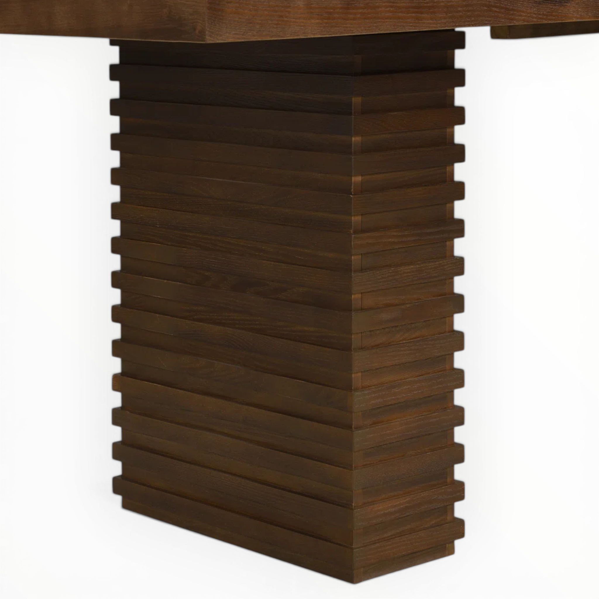 Wooden table leg with a stacked block design on a white background