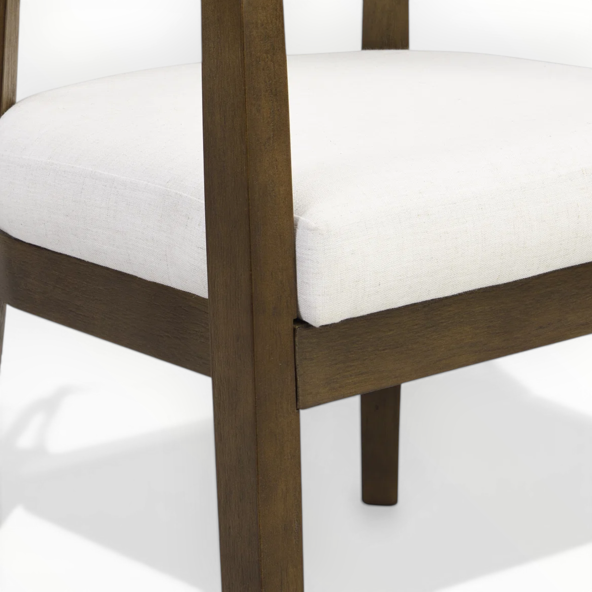 Wooden chair with white cushion on a white background