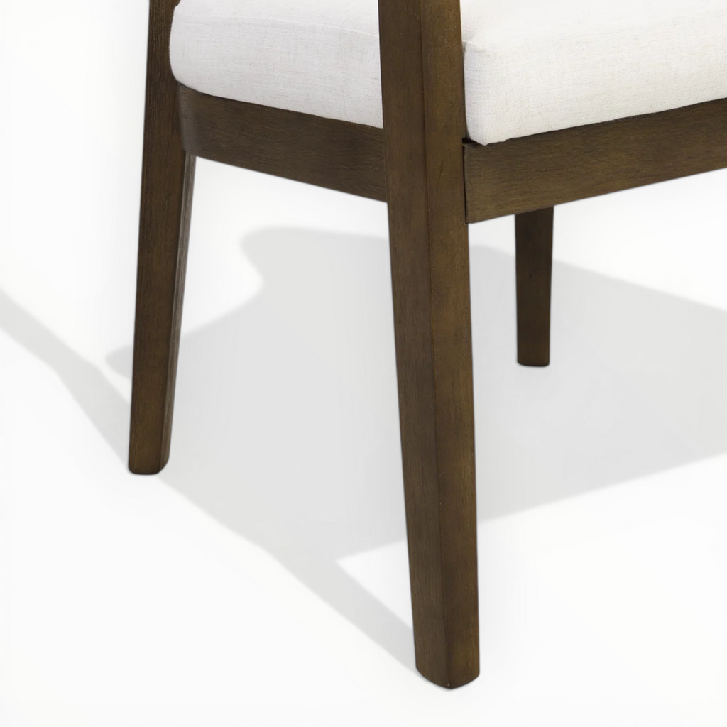 Close-up of a wooden chair leg on a white background