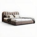 Modern bed with brown upholstered headboard and white bedding on a white background