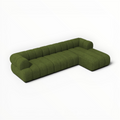 Green sectional sofa on a white background
