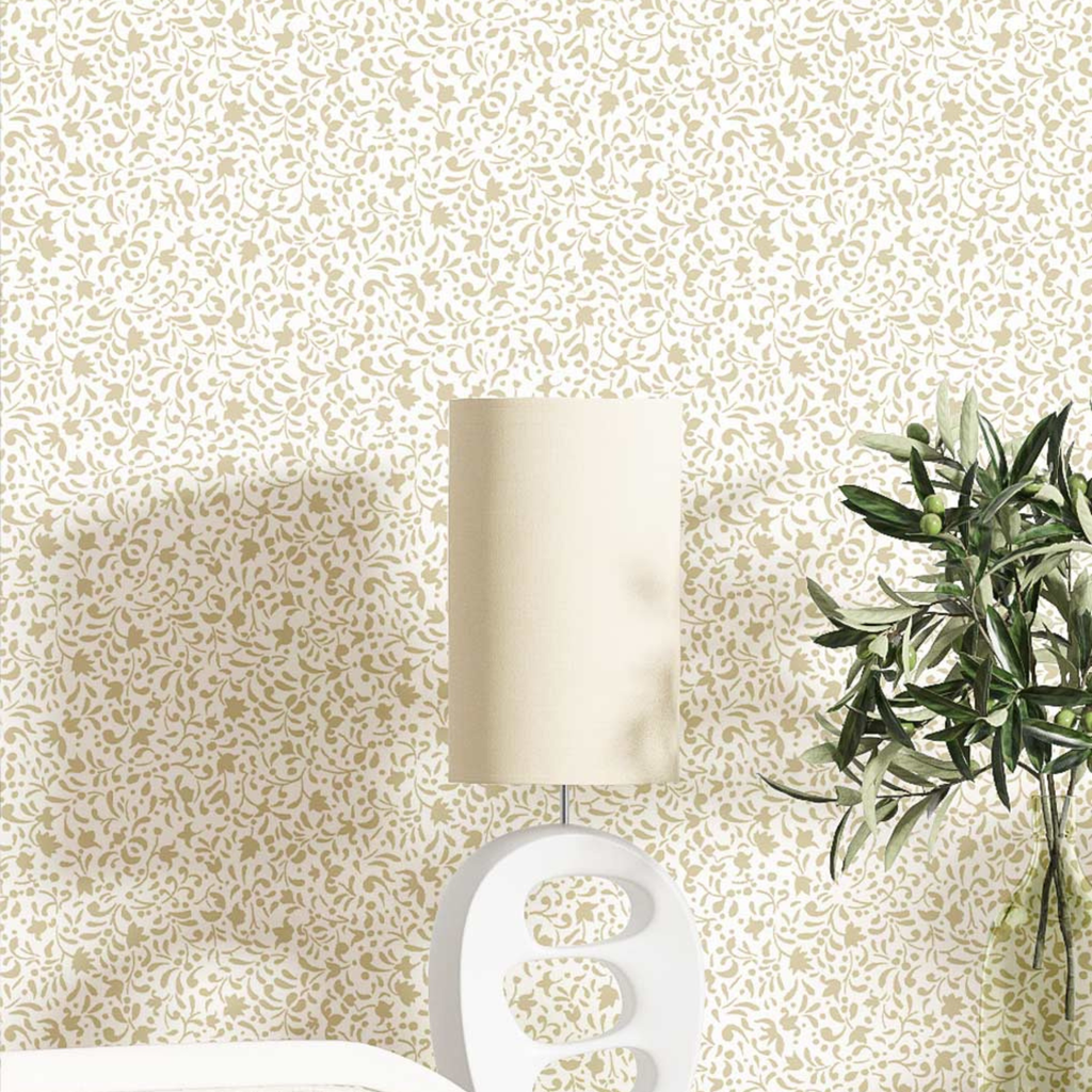 Decorative lamp and plant against a patterned wallpaper background