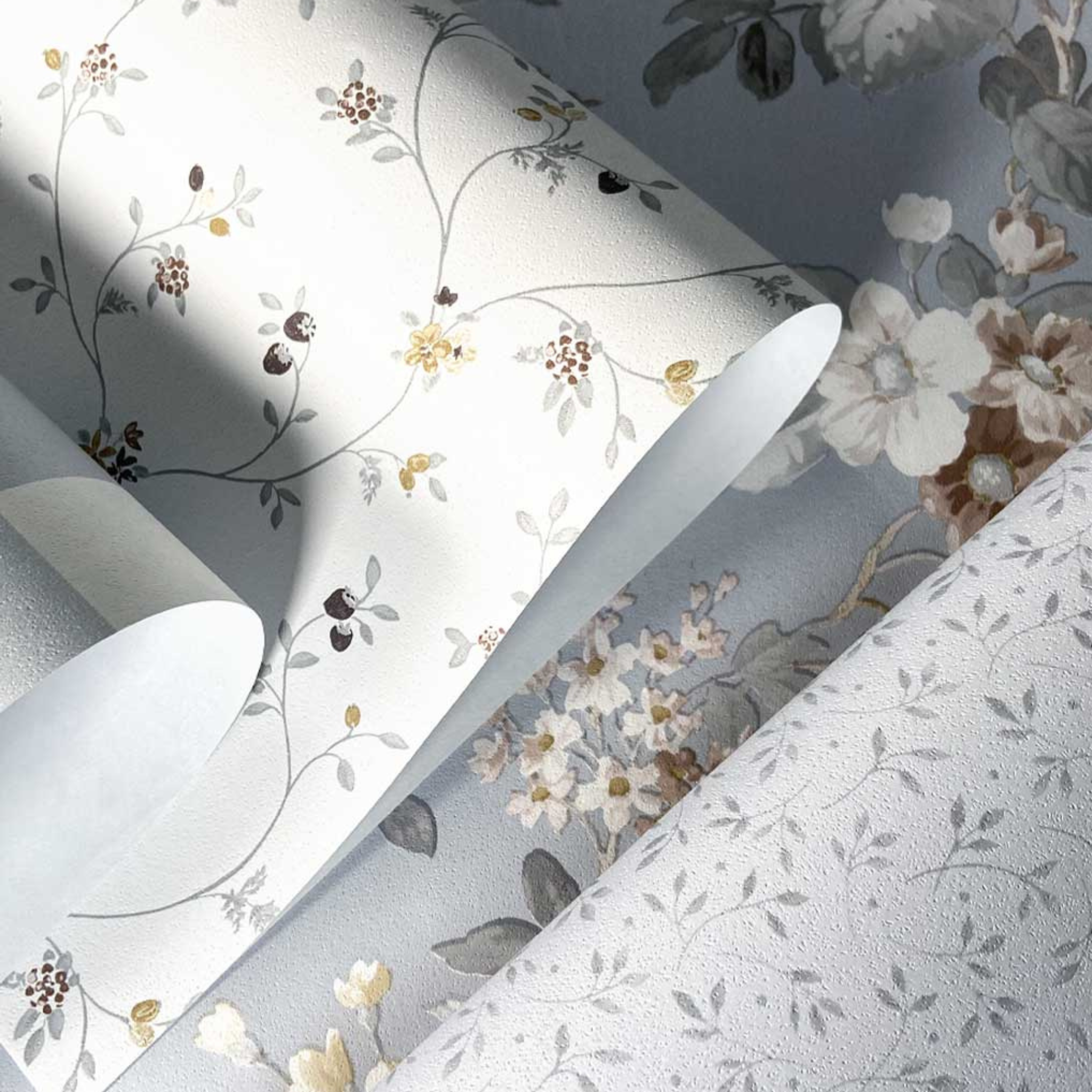 Close-up of floral-patterned fabric with a neutral color palette.