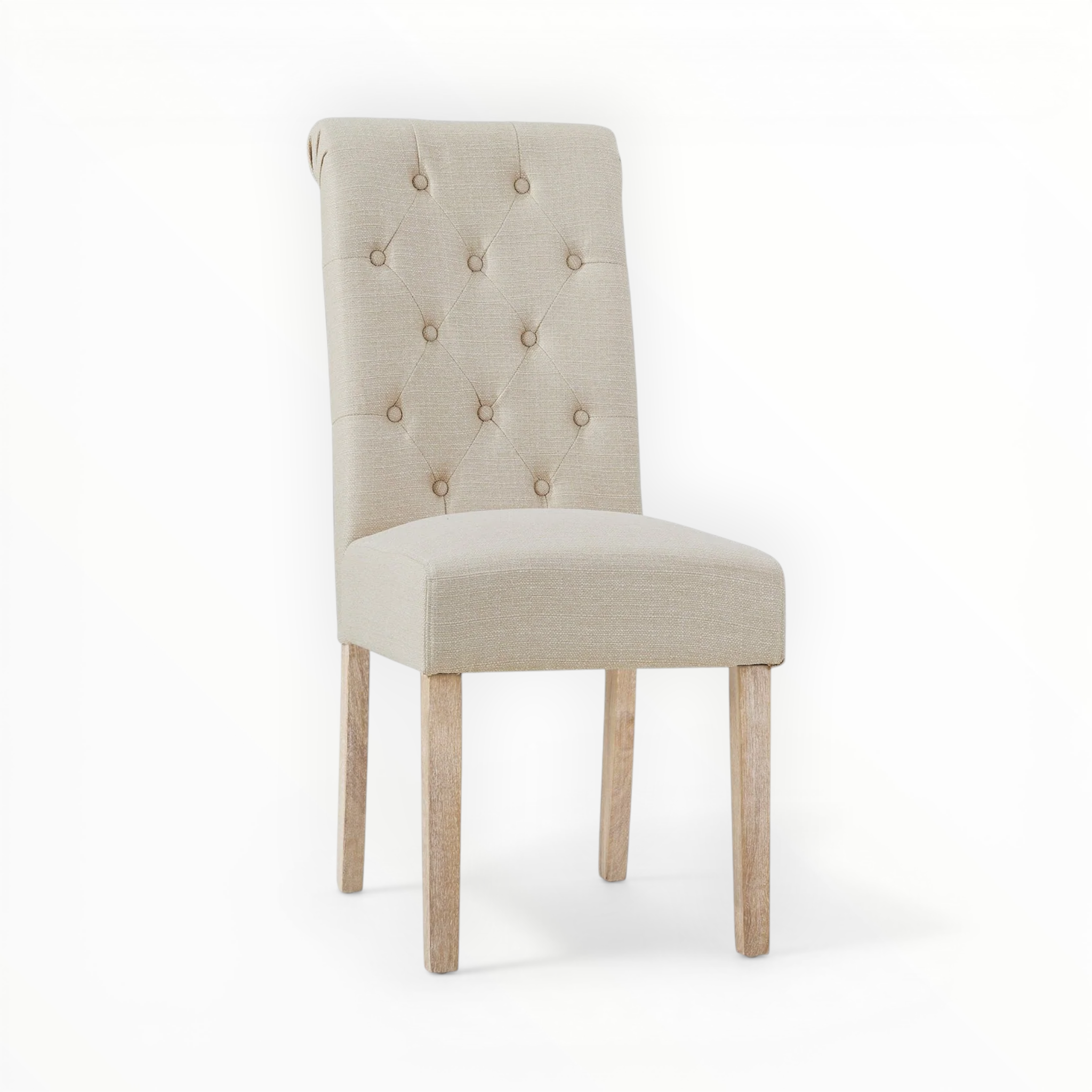 Beige upholstered chair with button tufting on a white background