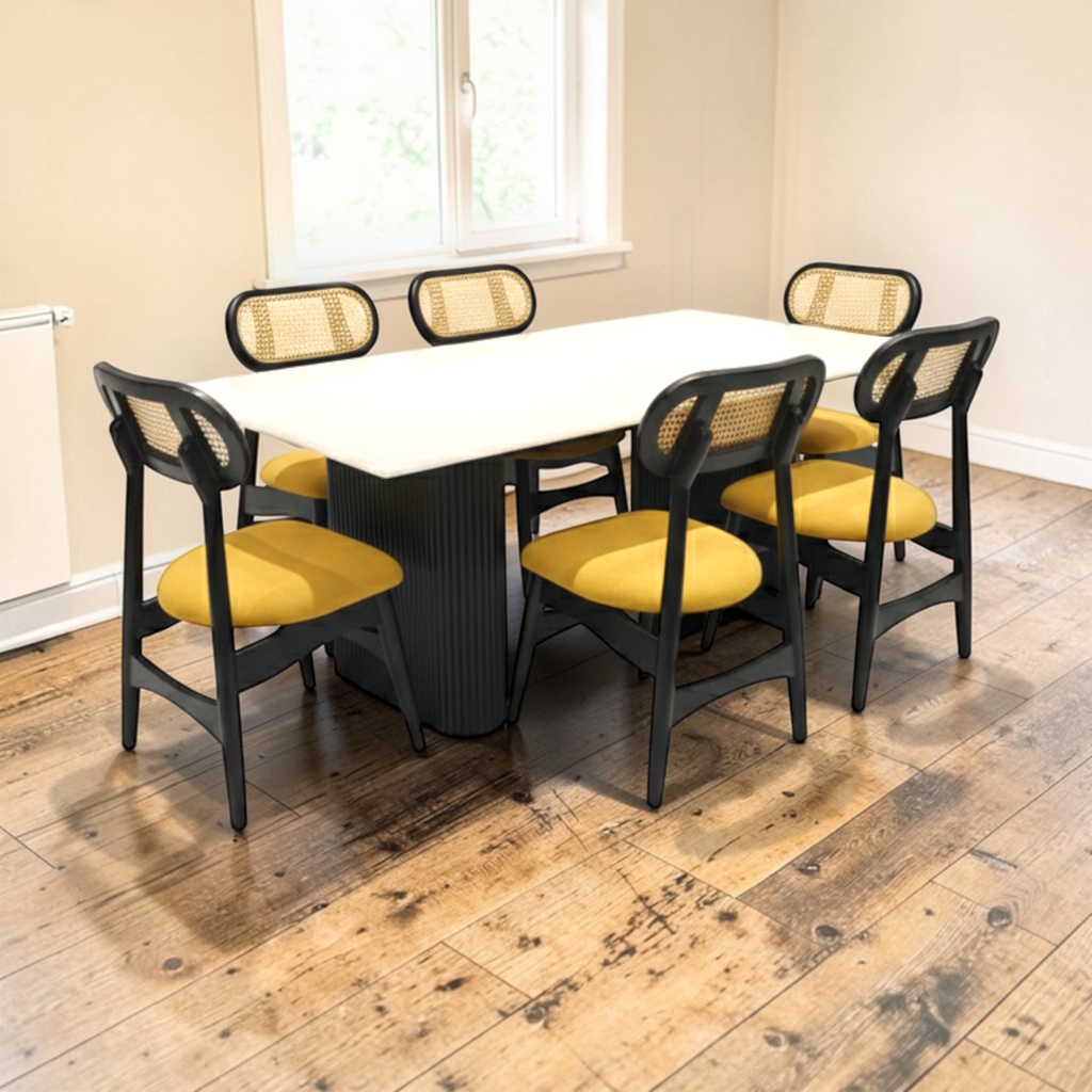 Dining table with six chairs on a wooden floor in a room with a window.