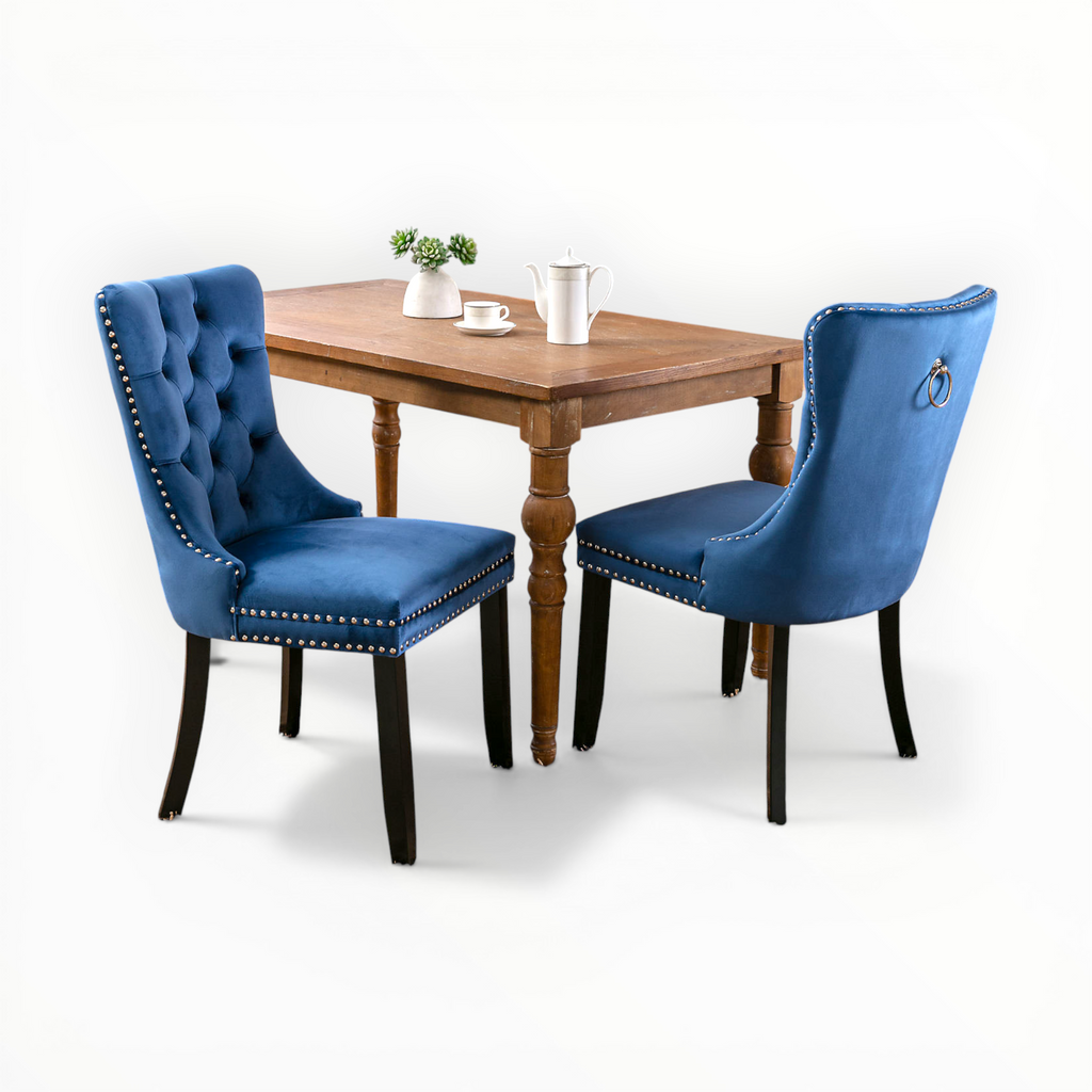 Wooden dining table with two blue chairs on a white background