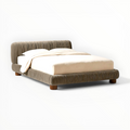 Bed with brown frame and beige bedding on a white background