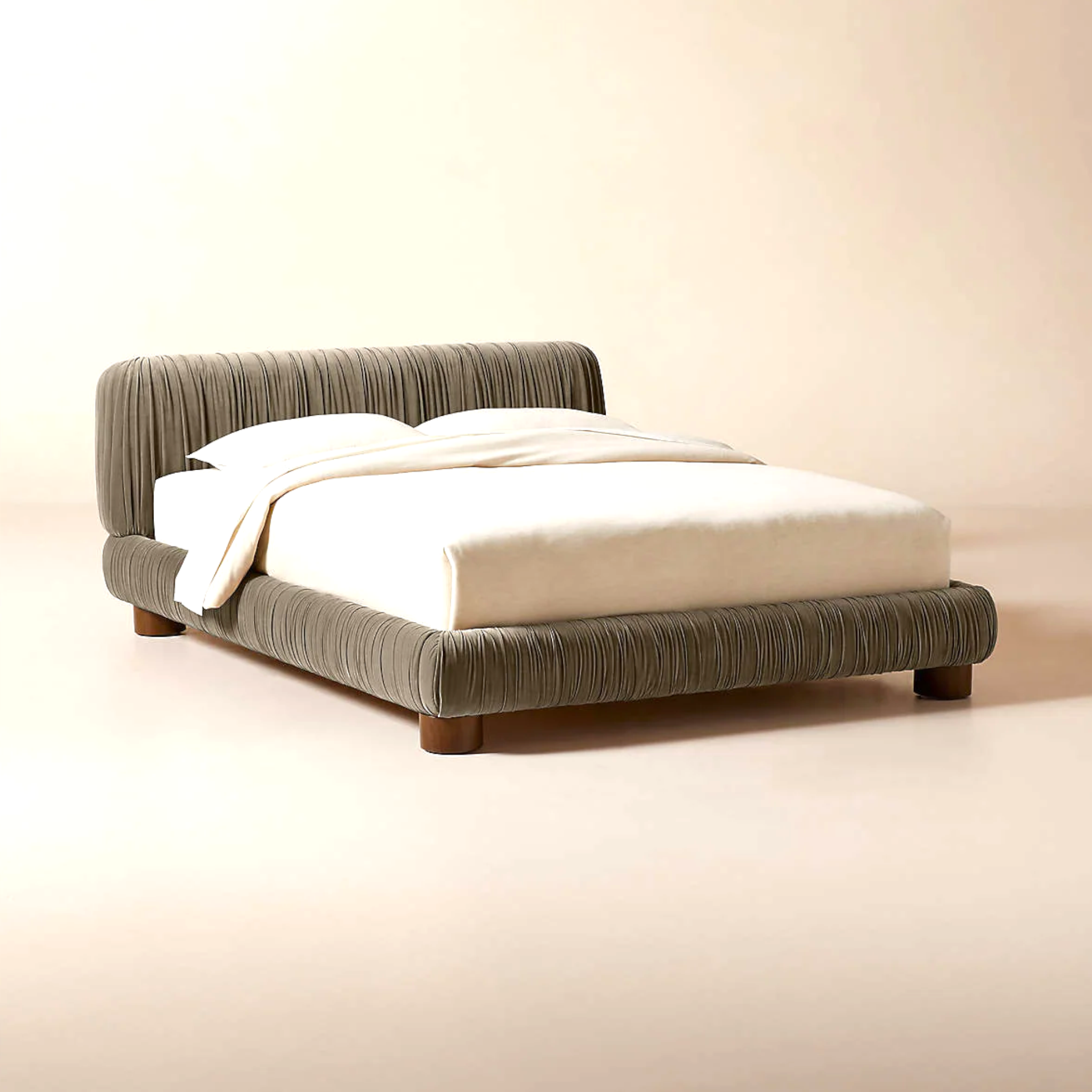 Gray upholstered bed with white bedding on a beige background