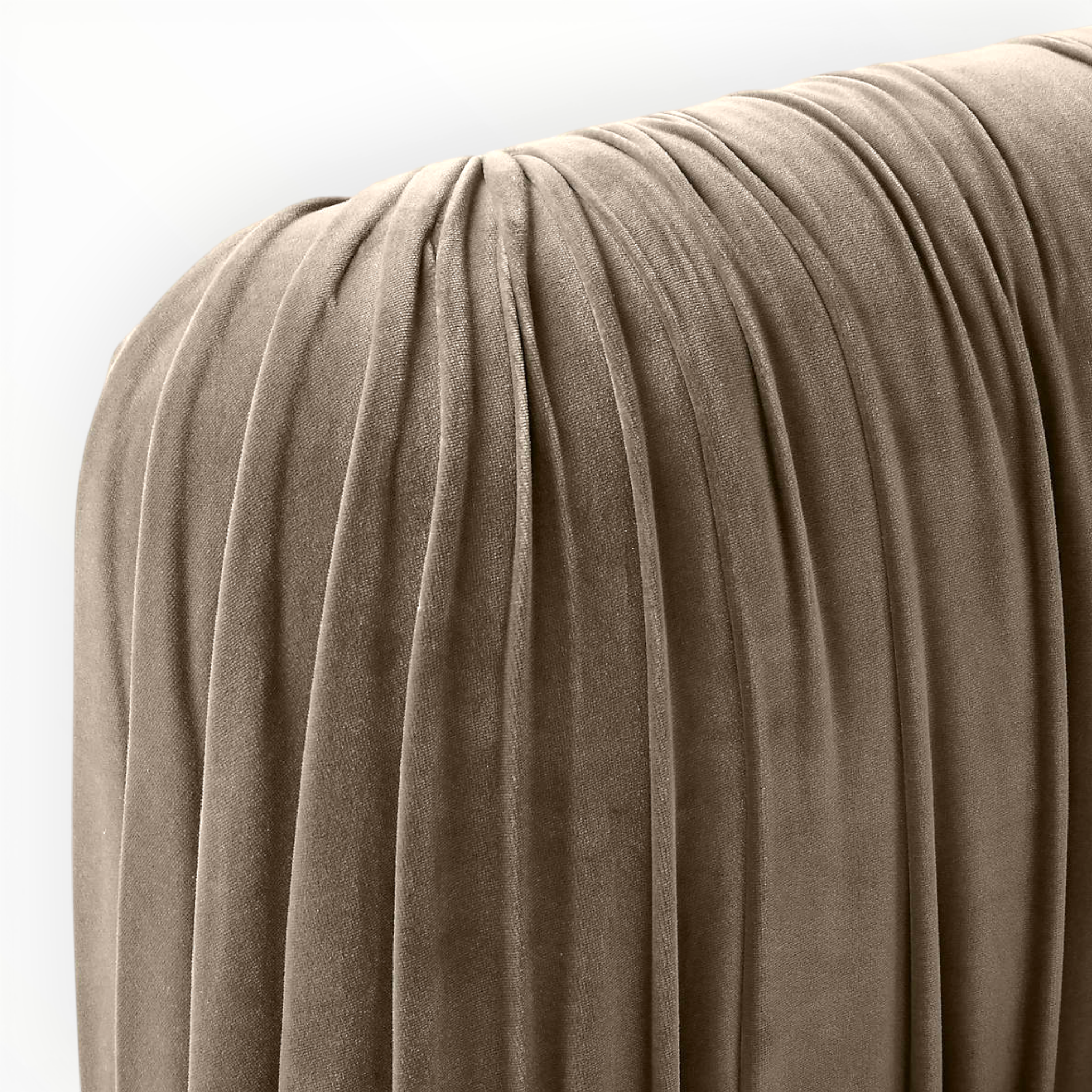 Close-up of a brown textured surface with folds on a white background