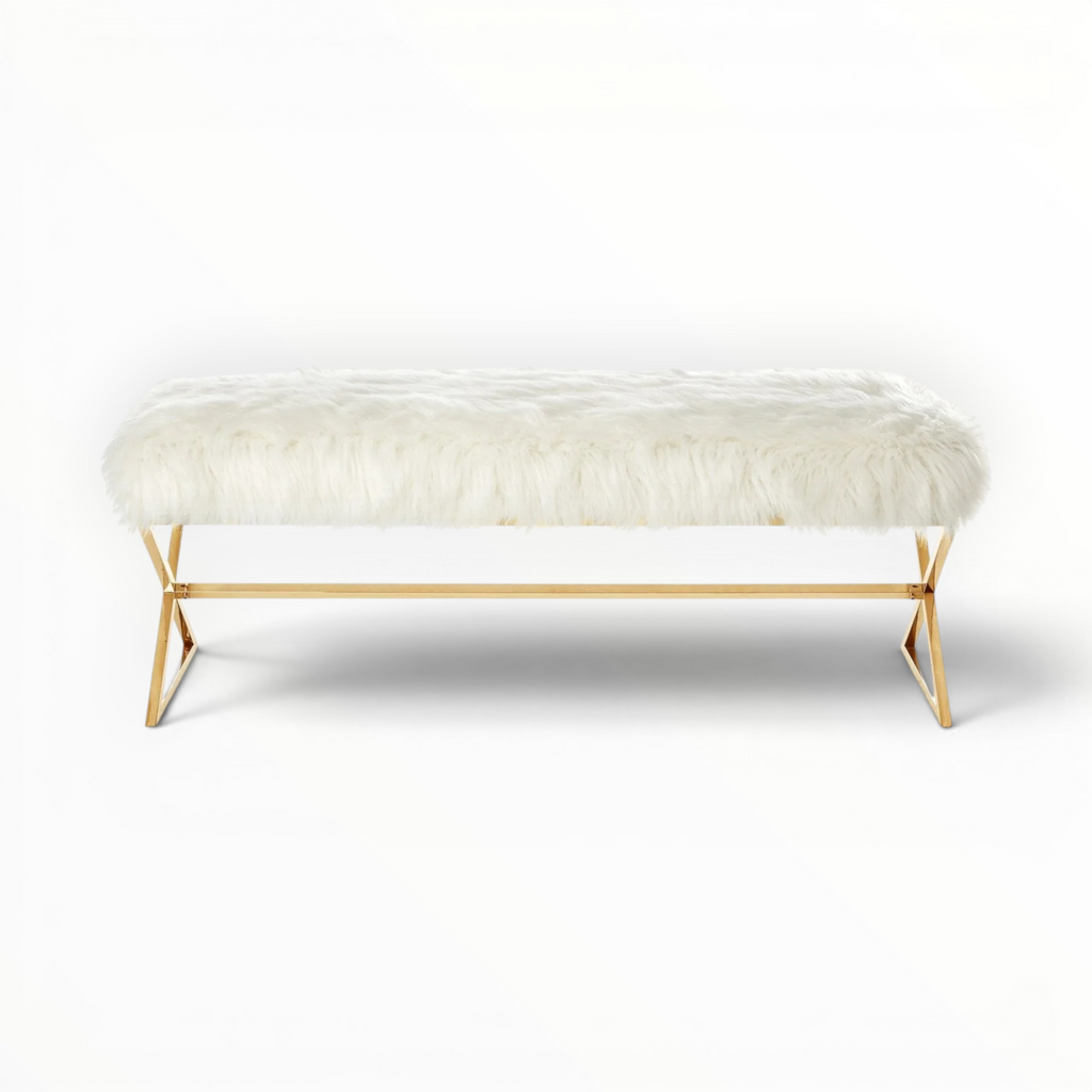 Bench with white fur cushion and gold metal frame on a white background