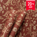 Roll of floral patterned fabric with a 20% off label on a red background