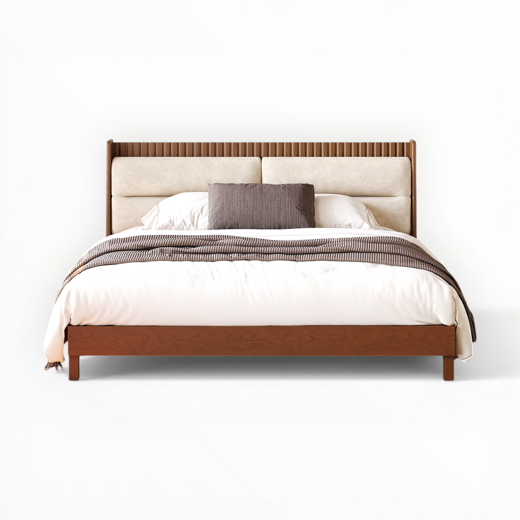 Bed with wooden frame and upholstered headboard on a white background