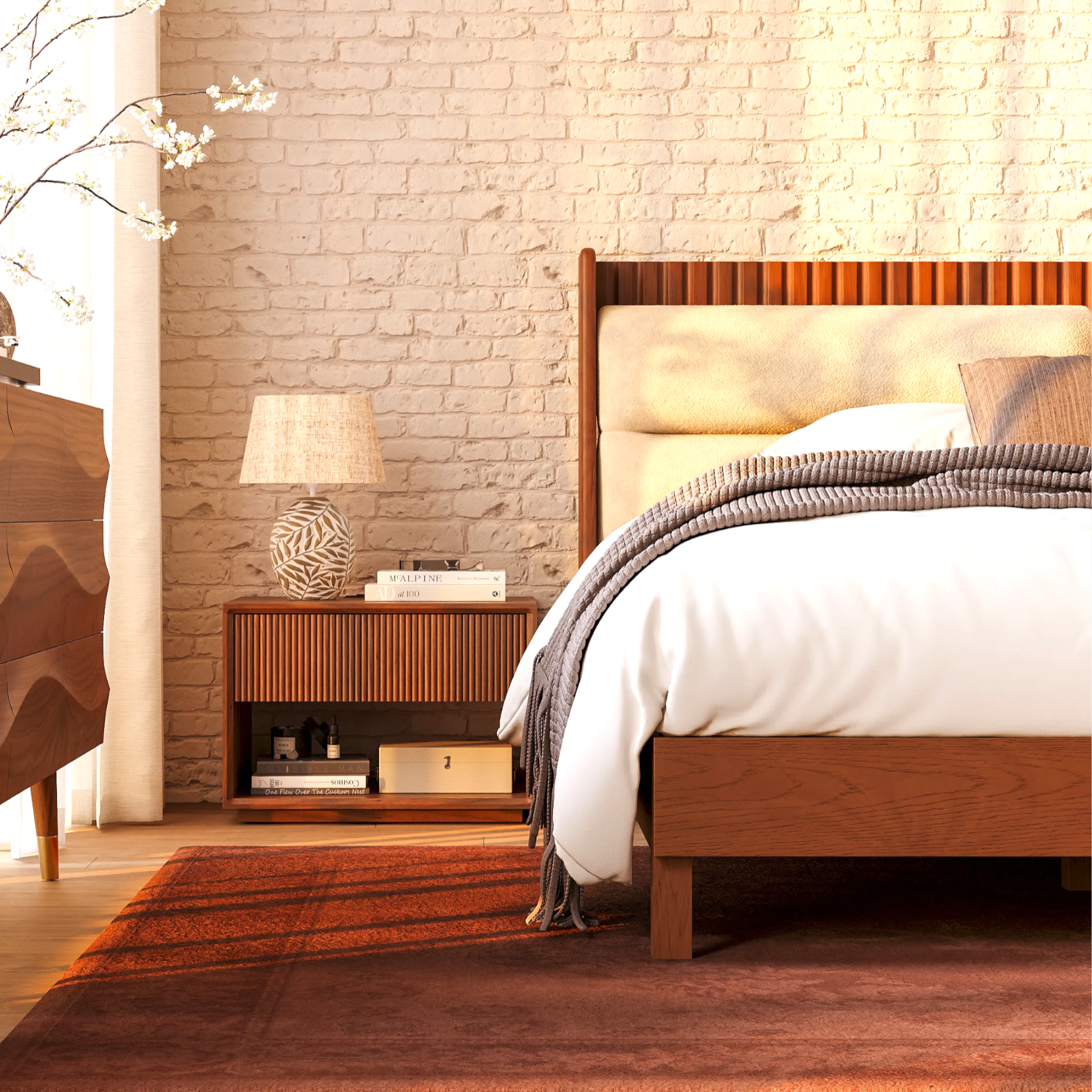 Wooden bed with white bedding in a bedroom with stone wall and wooden nightstand.