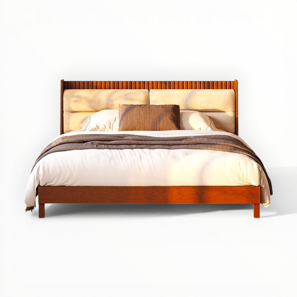 Wooden bed with upholstered headboard and bedding on a white background