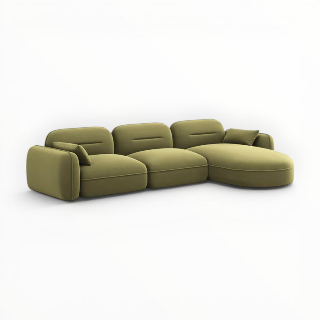 Green sectional sofa on a white background