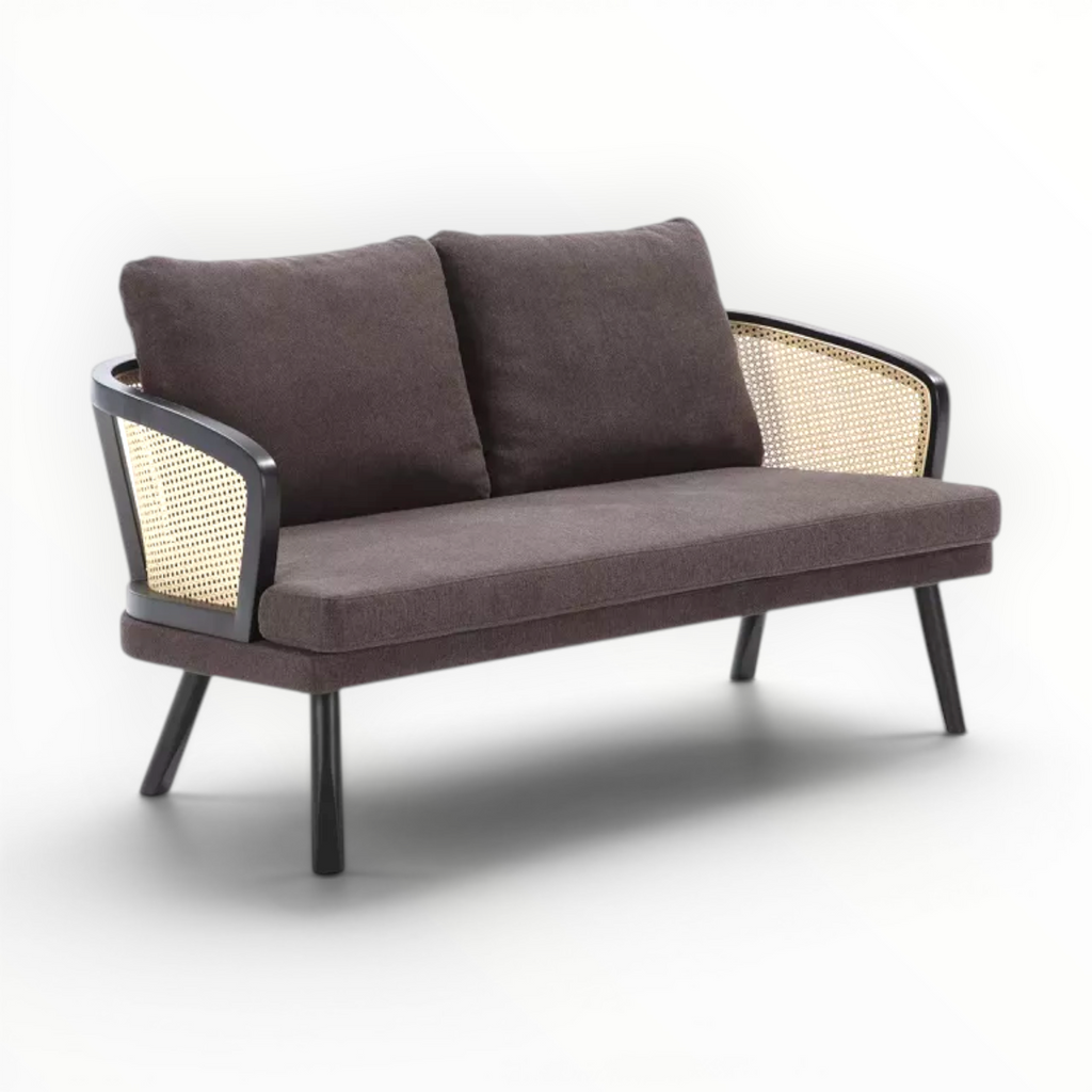 Brown sofa with wicker backrest on a white background