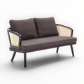 Brown sofa with wicker backrest on a white background