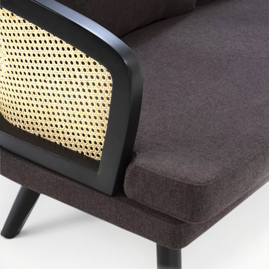 Brown upholstered chair with woven backrest on a white background