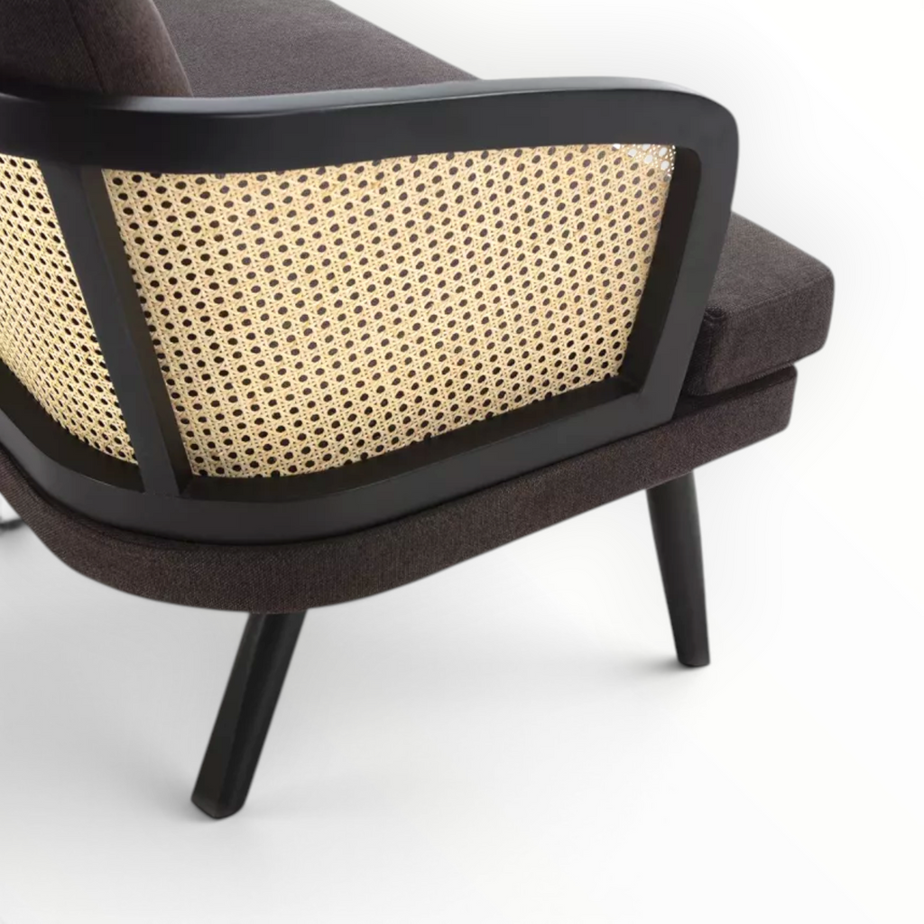 Chair with woven backrest and dark frame on a white background