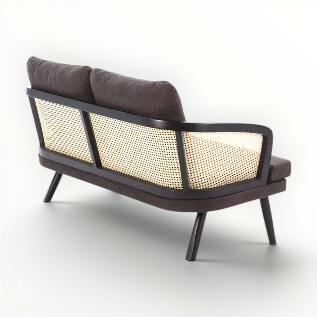 Modern sofa with brown cushions and a wicker backrest on a white background
