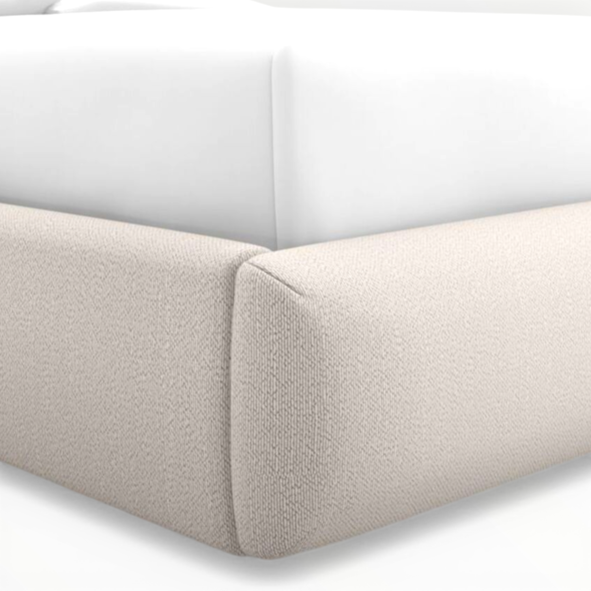 Close-up of a beige upholstered corner of a sofa on a white background