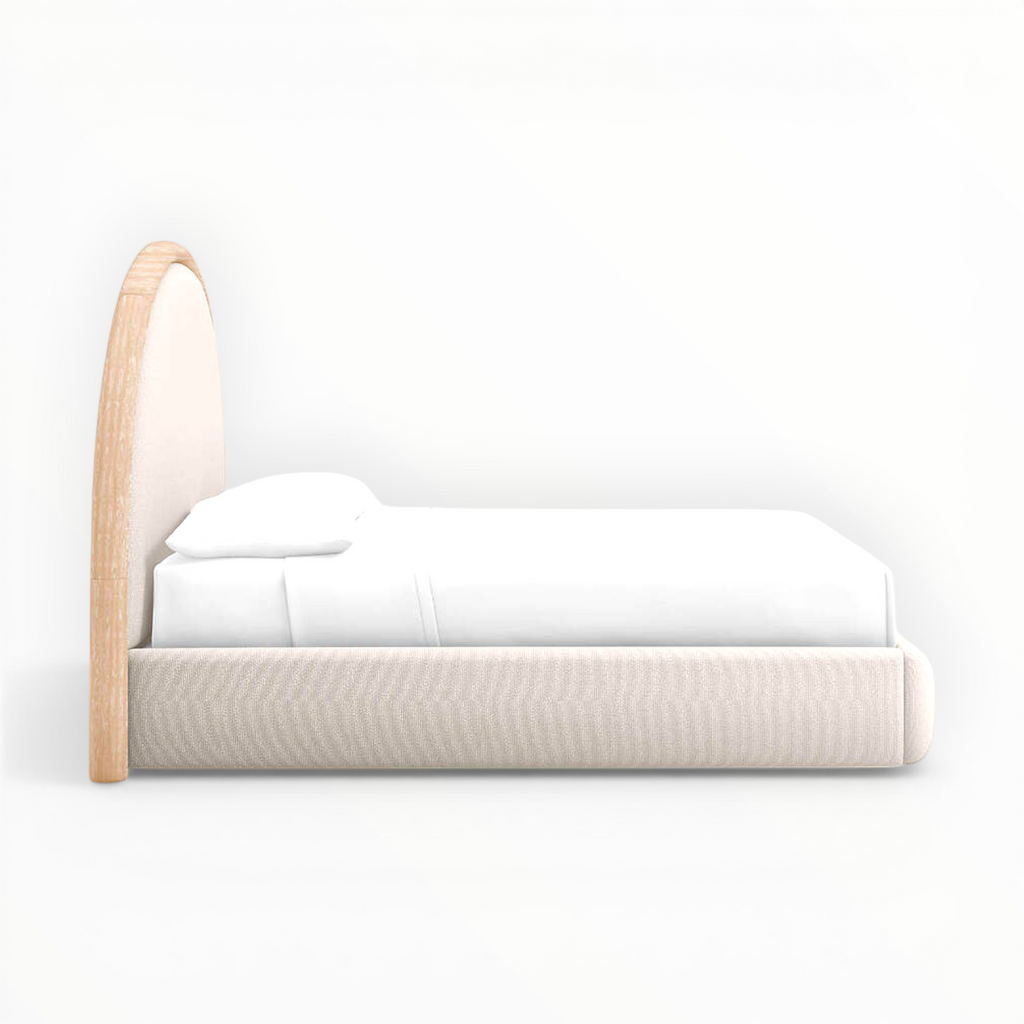 Modern bed with wooden frame and white bedding on a white background