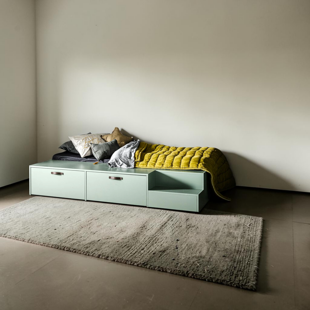 Kiddo low-profile kids storage bed styled in a children's bedroom with yellow quilt and cushions – mint deco paint finish – Woodkraft Studio Hyderabad
