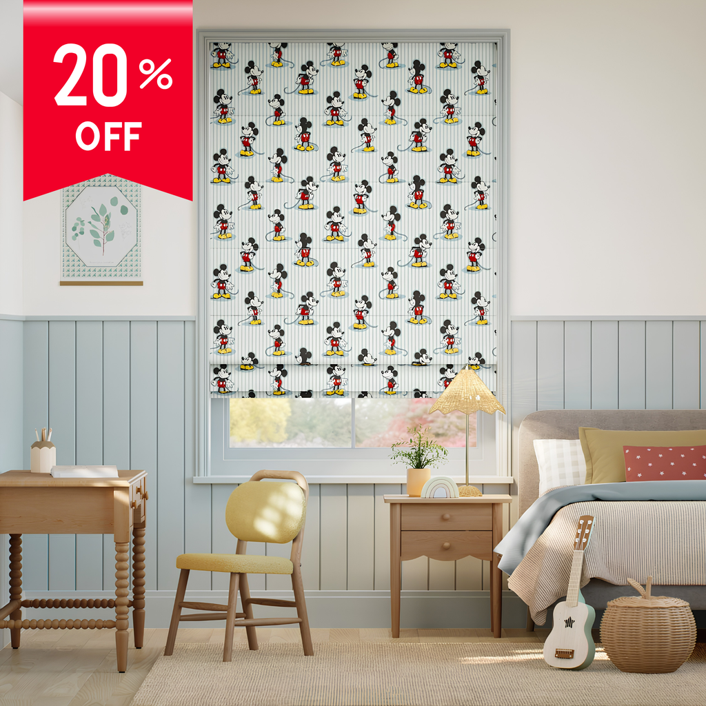 Bedroom with a window featuring a Mickey Mouse patterned roller blind, 20% off label on the left.