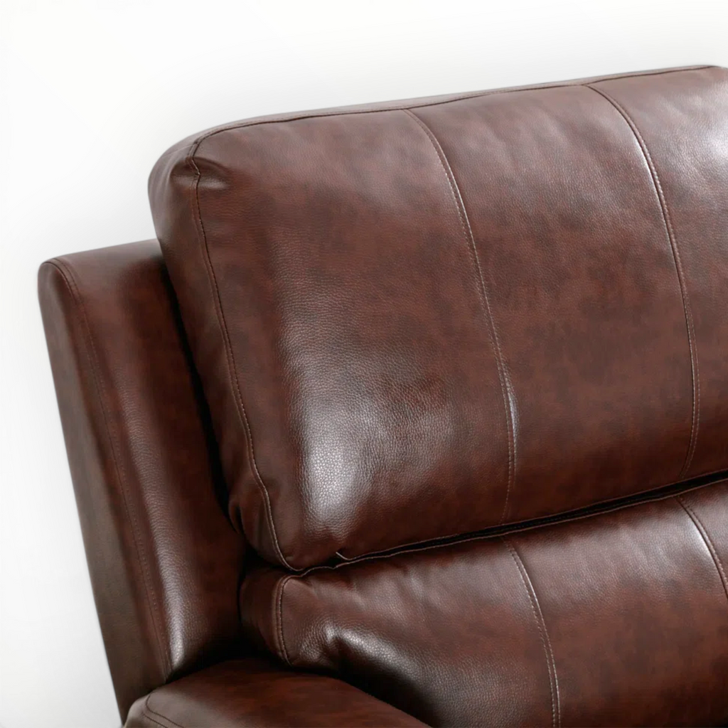 Brown leather sofa with a white background