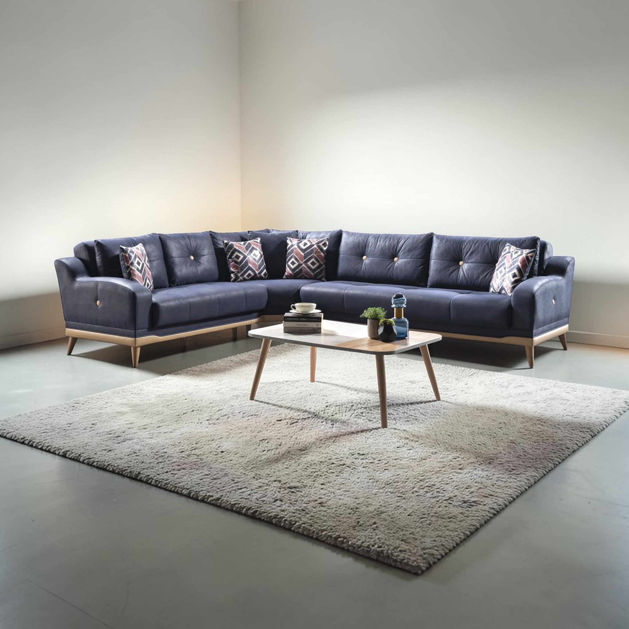 Modern living room with a dark blue sectional sofa and a coffee table.