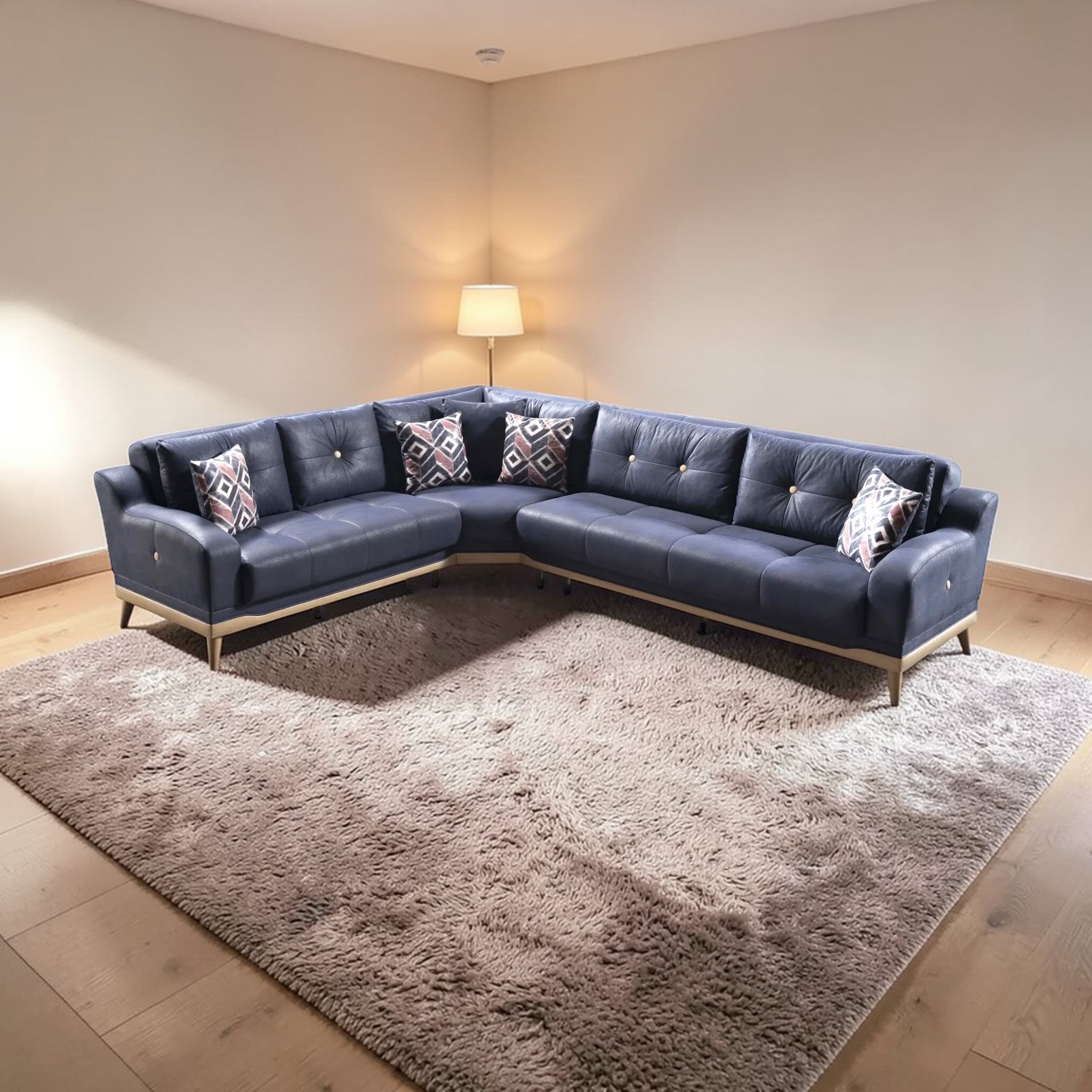 Blue sectional sofa with patterned cushions on a large fluffy rug in a room.