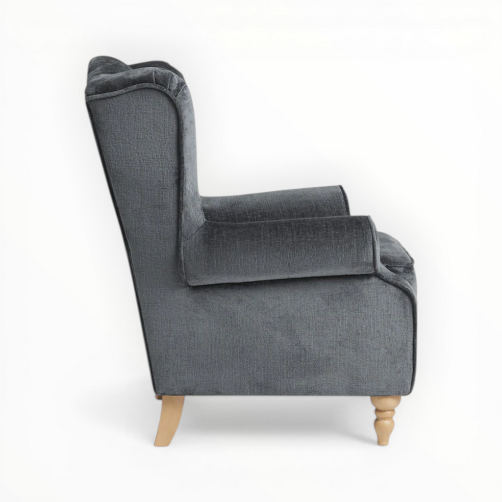 Gray armchair with wooden legs on a white background