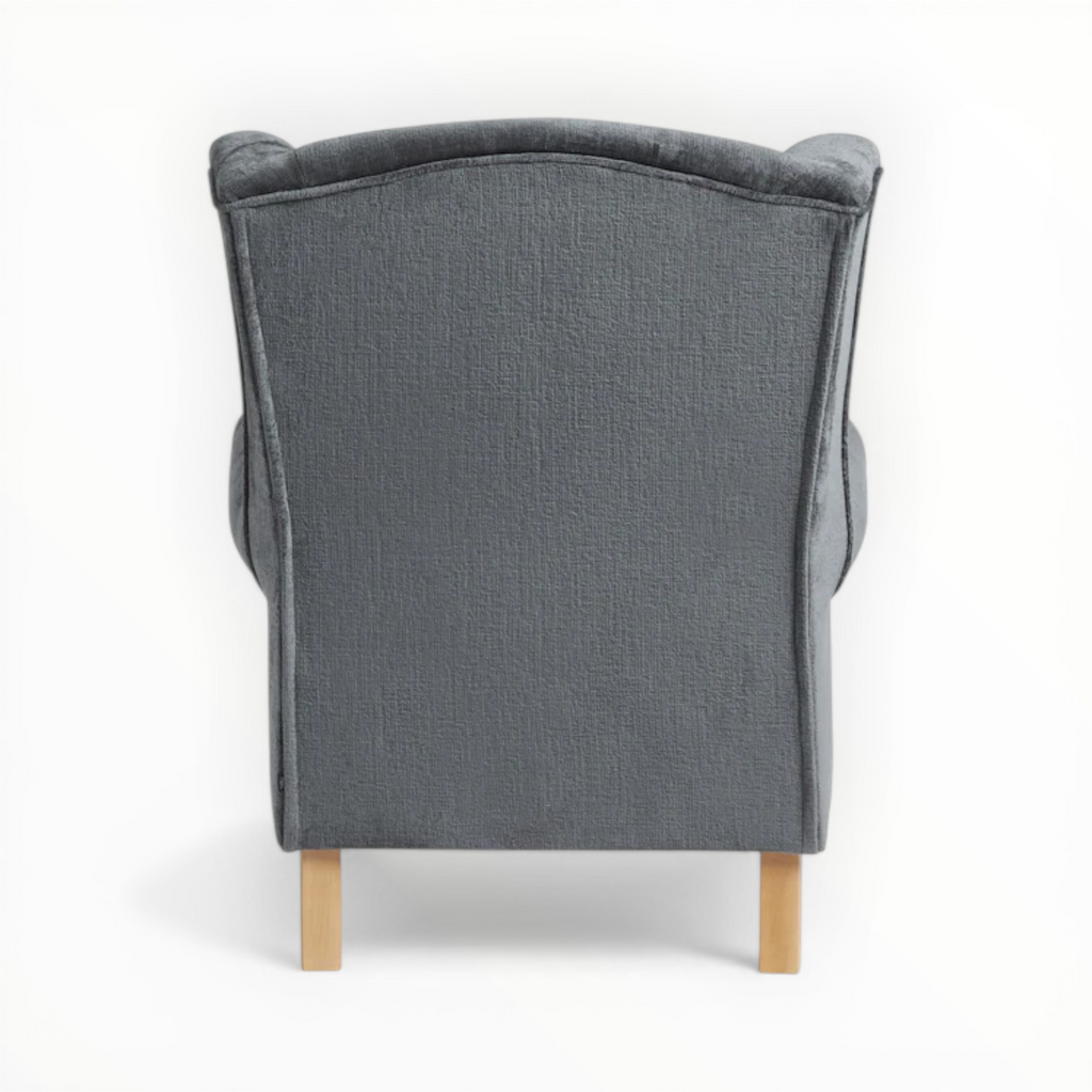 Gray upholstered chair with wooden legs on a white background