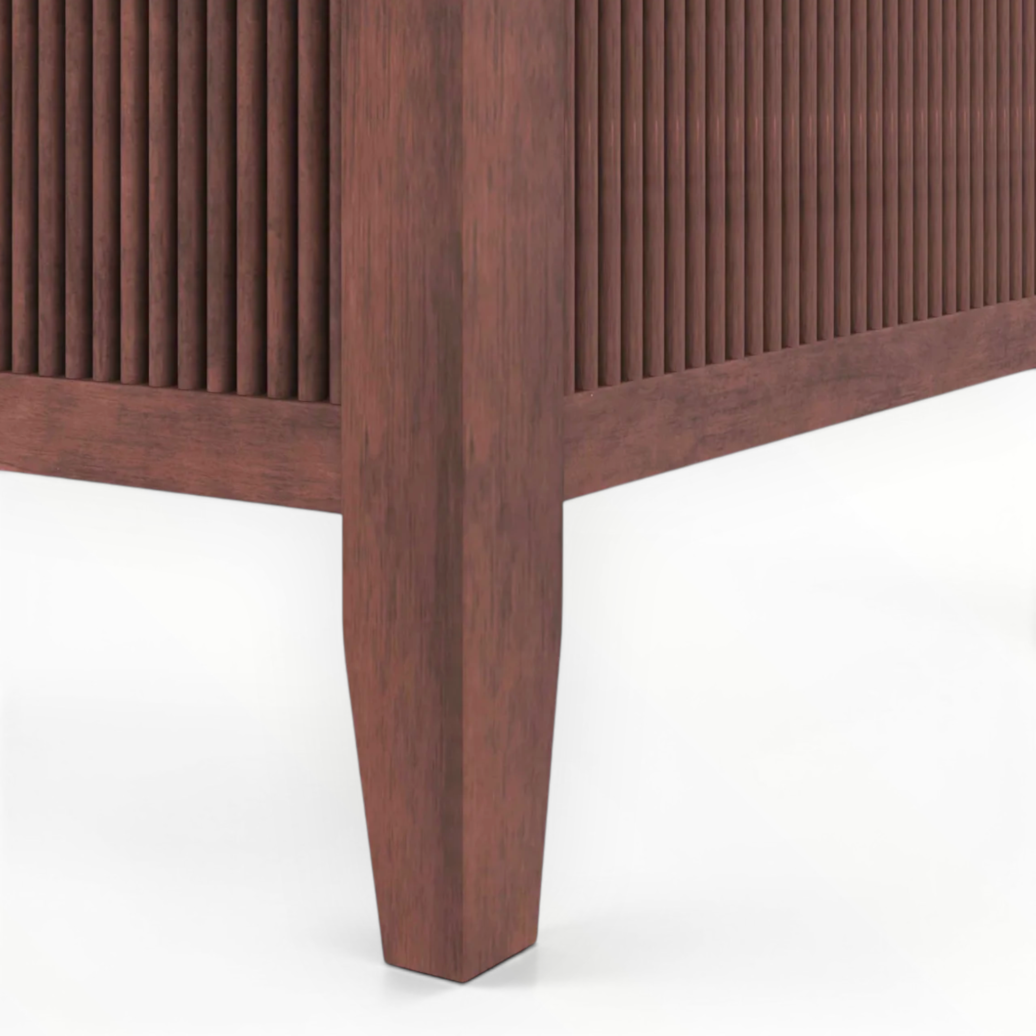 Close-up of a wooden cabinet with a ribbed texture on a white background