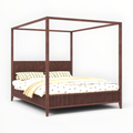 Wooden canopy bed with bedding on a white background