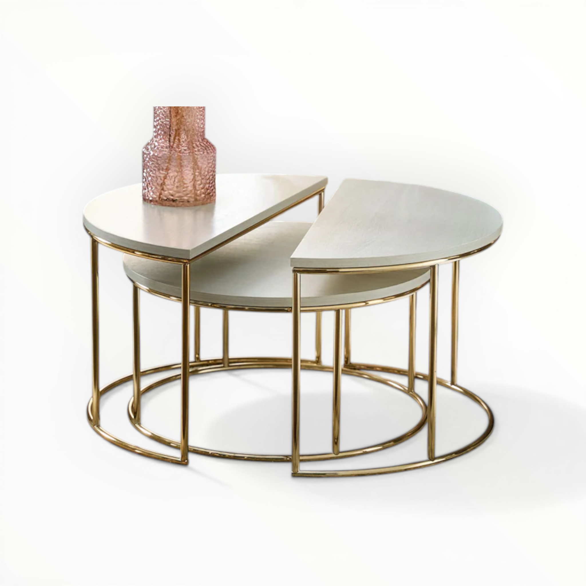 Nest of three round tables with gold metal frames on a white background