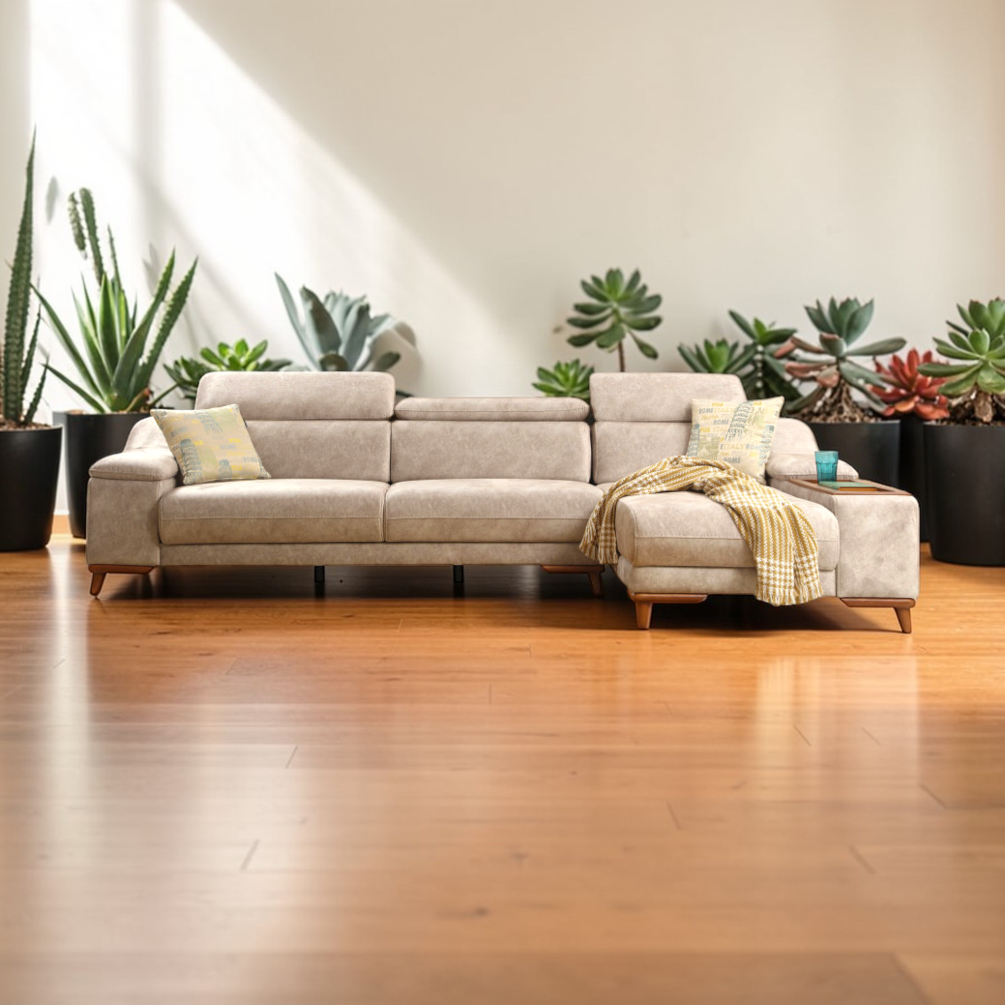 Beige sectional sofa in a living room with plants and a wooden floor.