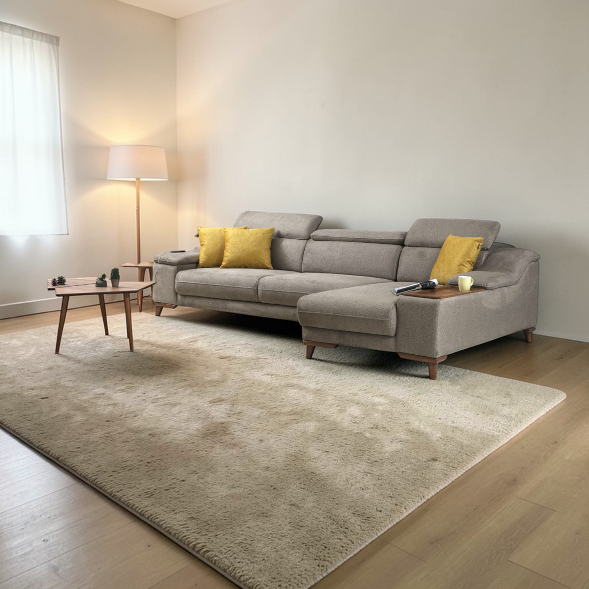 Gray sectional sofa with yellow cushions in a living room setting.