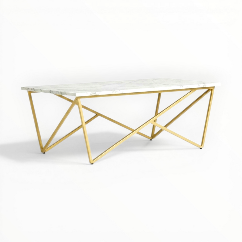 Coffee table with marble top and gold geometric base on a white background