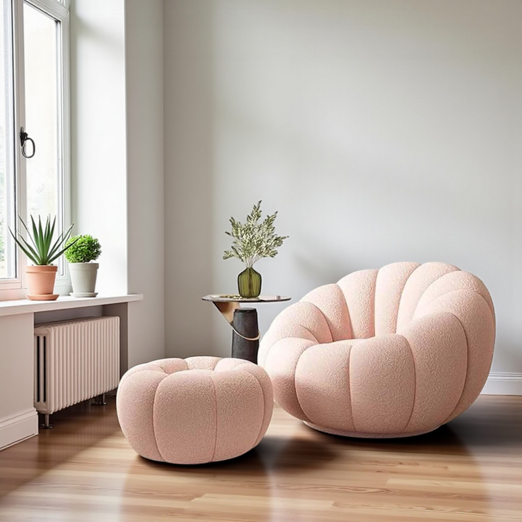Pink armchair and ottoman in a room with a window and plants.