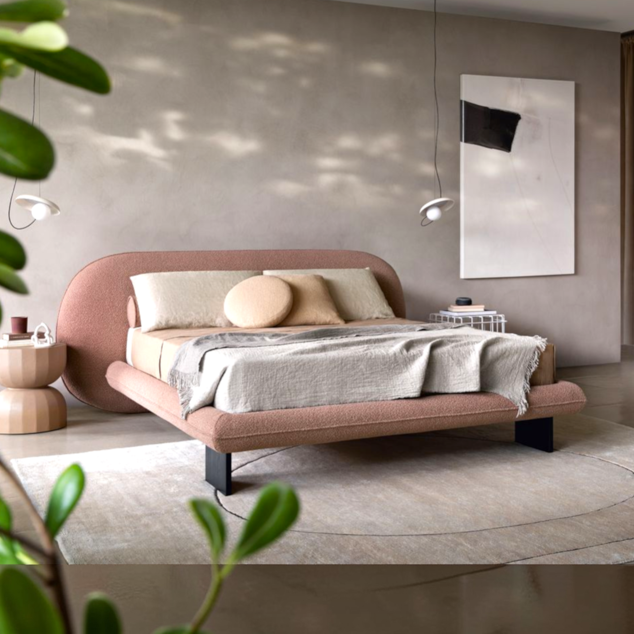 Modern bedroom with a pink bed and neutral decor