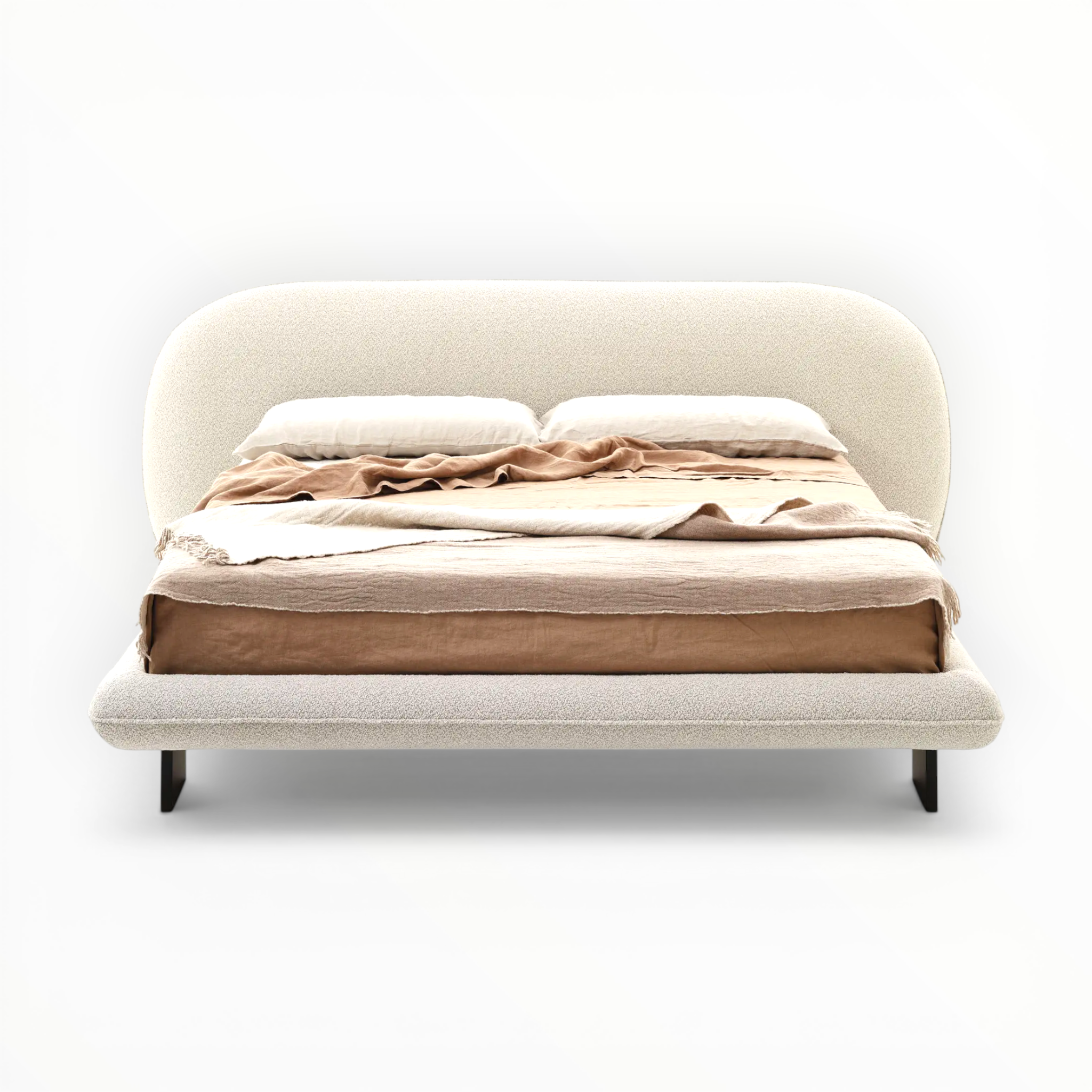 Beige upholstered bed with a brown blanket on a white background