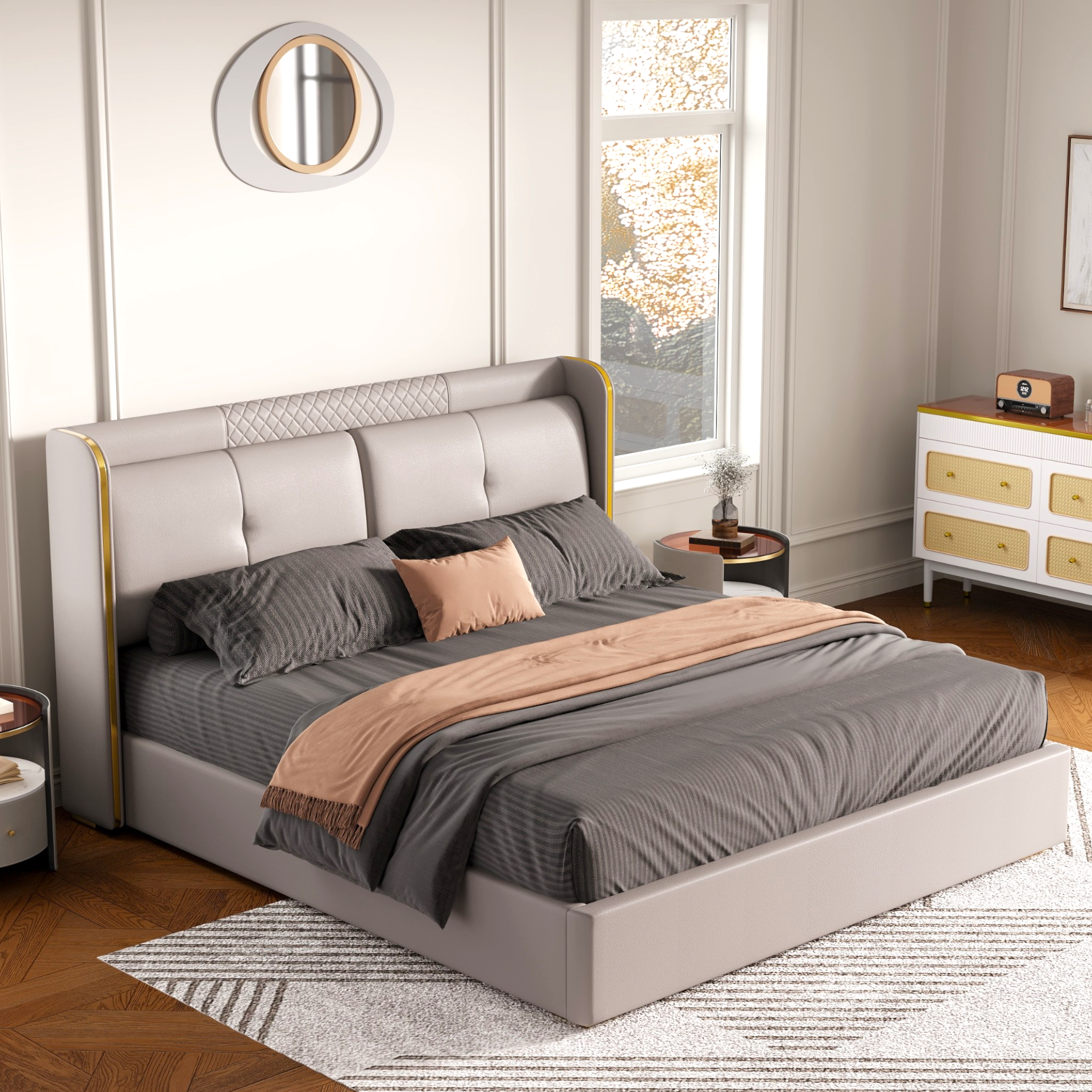 Neatly made bed with gray bedding in a bedroom setting.