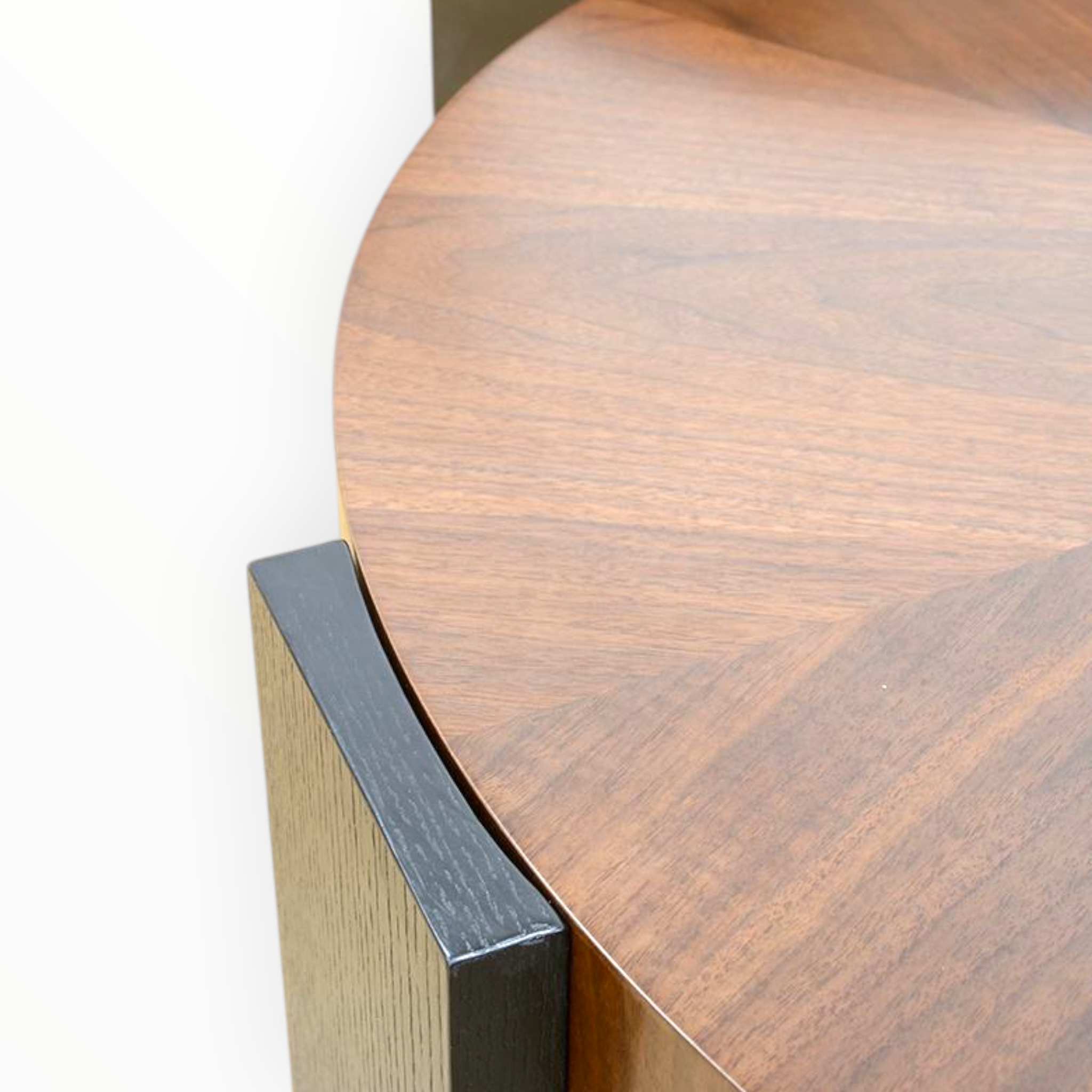 Close-up of Odin coffee table walnut sunburst top grain and dark solid wood block leg joinery detail