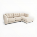 Beige sectional sofa on a white background