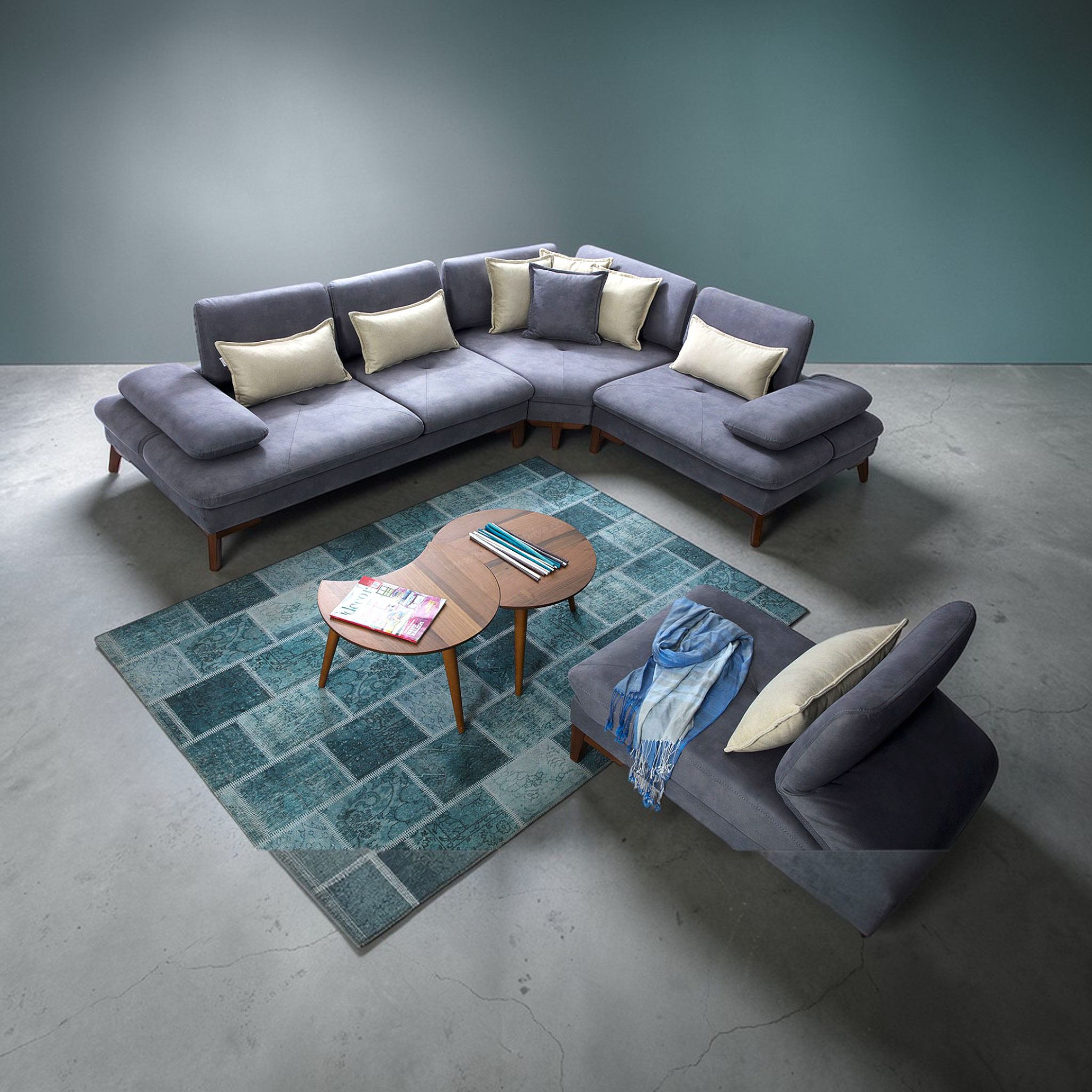 Gray sectional sofa with cushions in a modern living room setting.