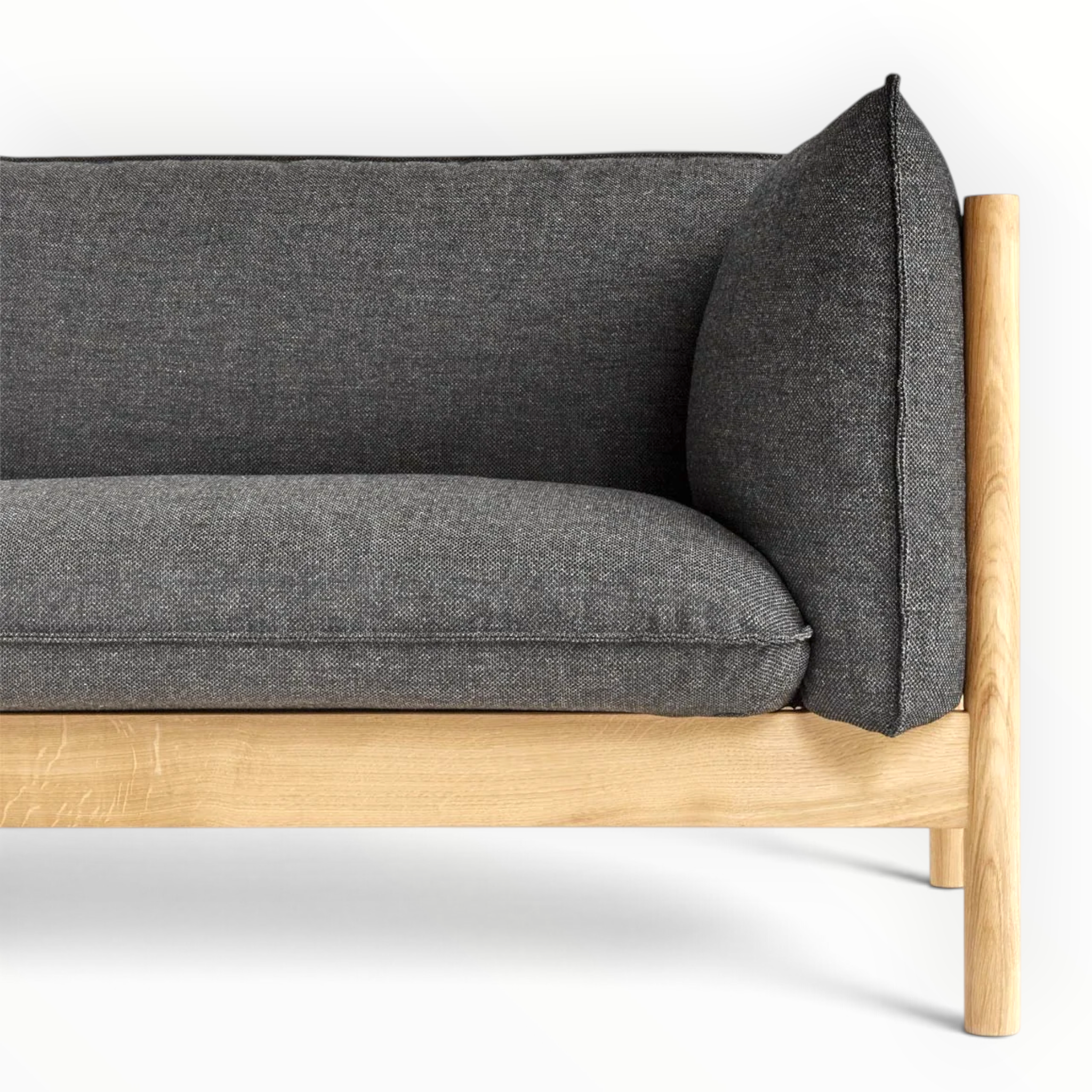 Phantom sofa upholstered seat and arm with exposed teakwood frame — Woodkraft Studio Hyderabad