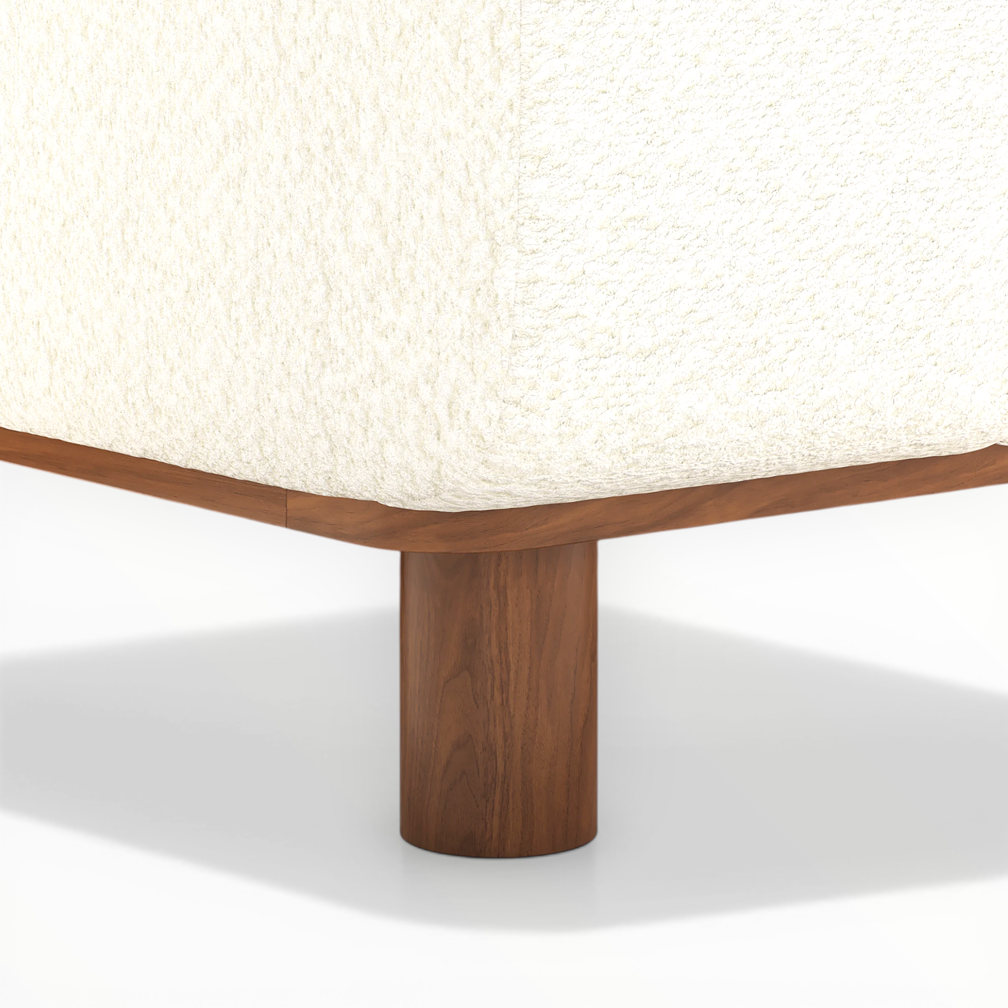Wooden table leg with a textured white surface above