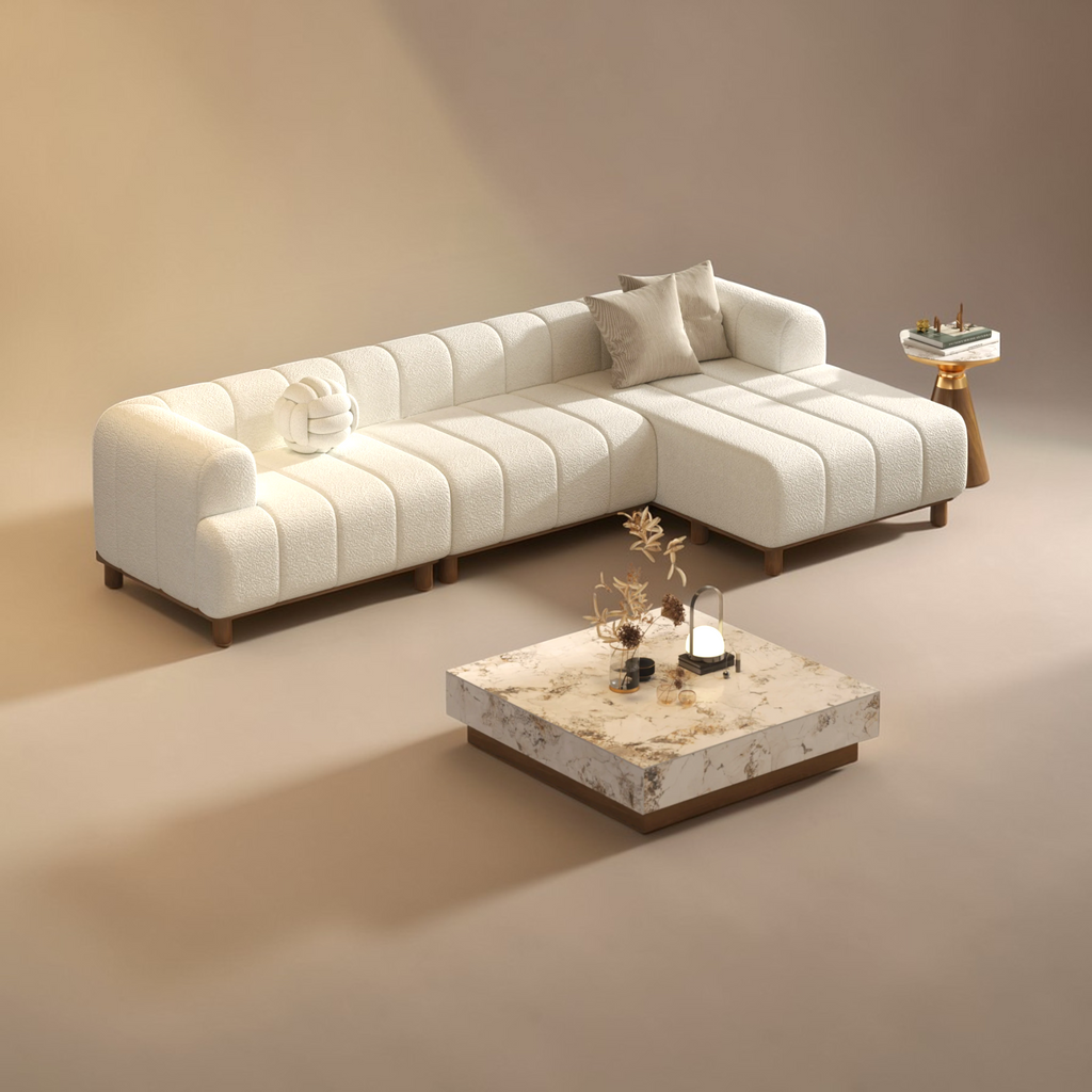 White sectional sofa with a marble coffee table in a beige room