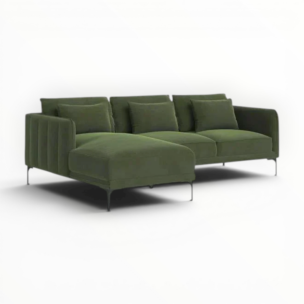 Green sofa with chrome legs on a white background